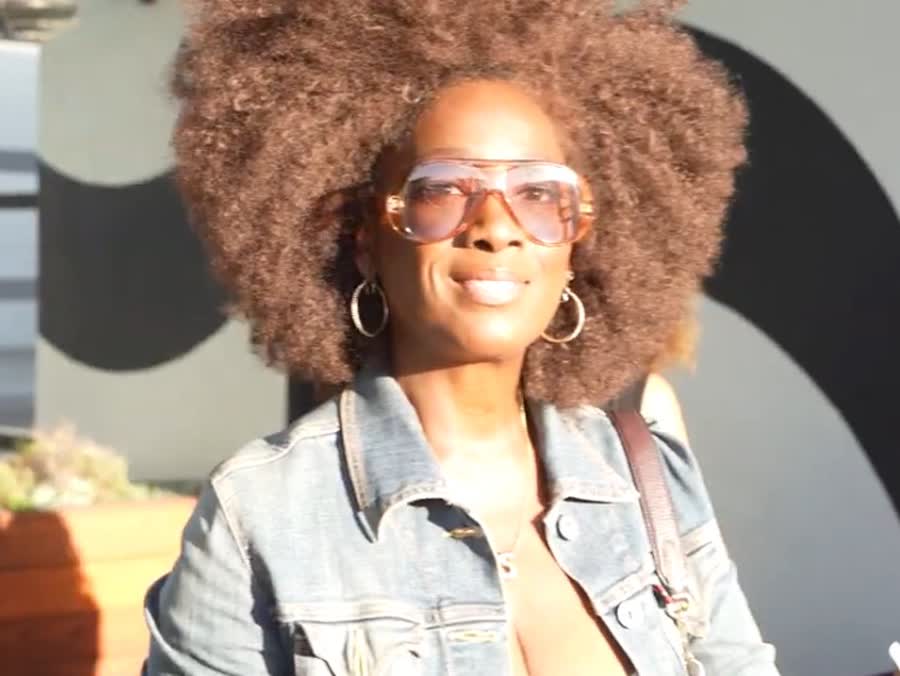 A guest smiling in the room during a community gathering