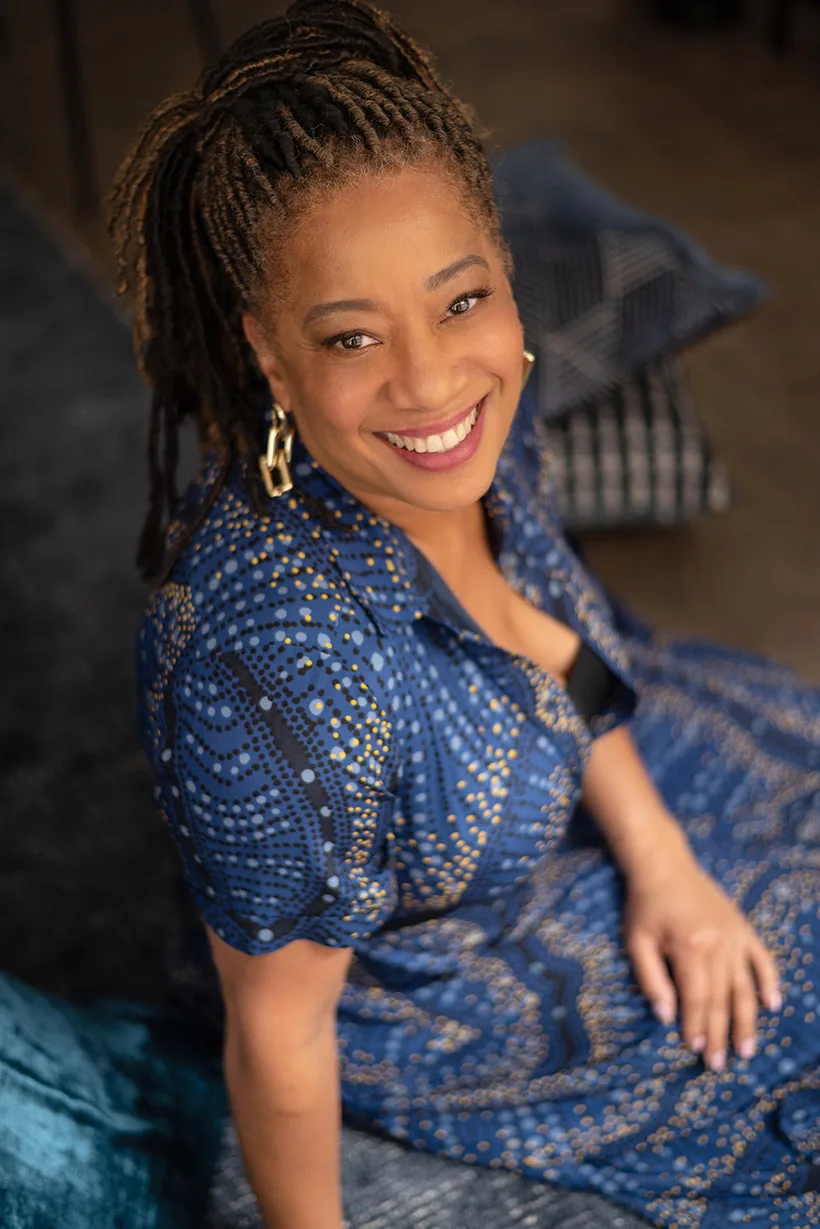 Lisane Basquiat portrait in a navy patterned dress